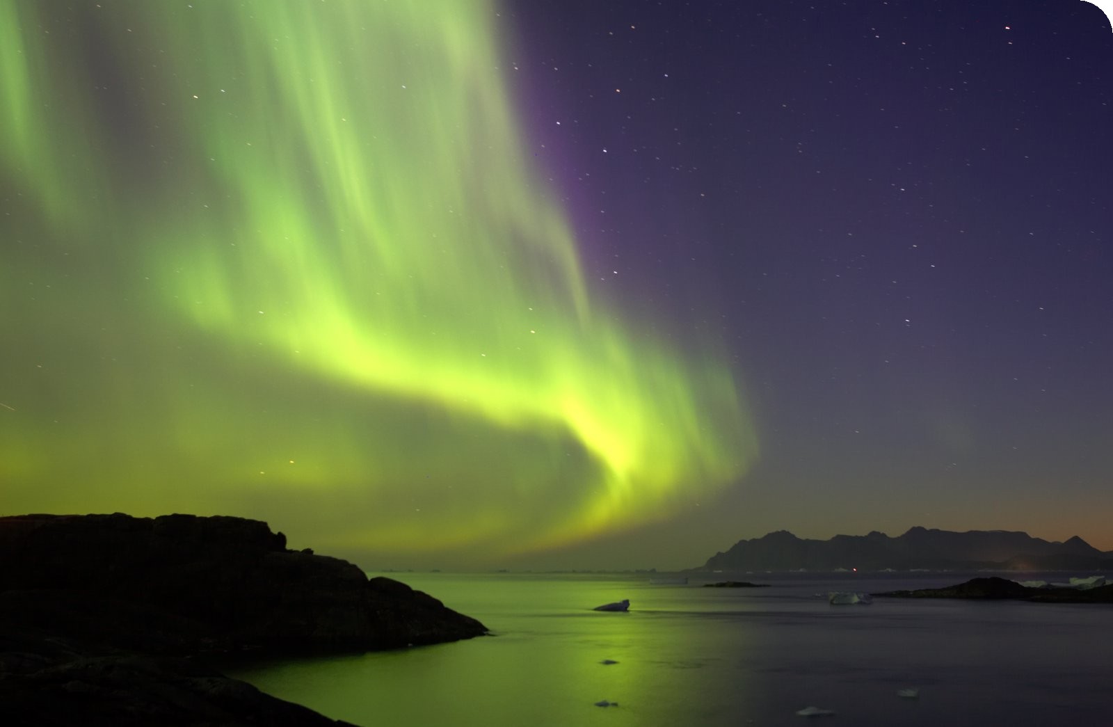 http://www.greenlandholiday.com/Portals/0/Photos/Northern%20Lights%20over%20the%20fjords.jpg